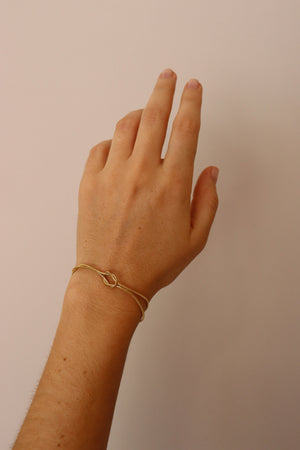 PULSERA NUDO DORADA